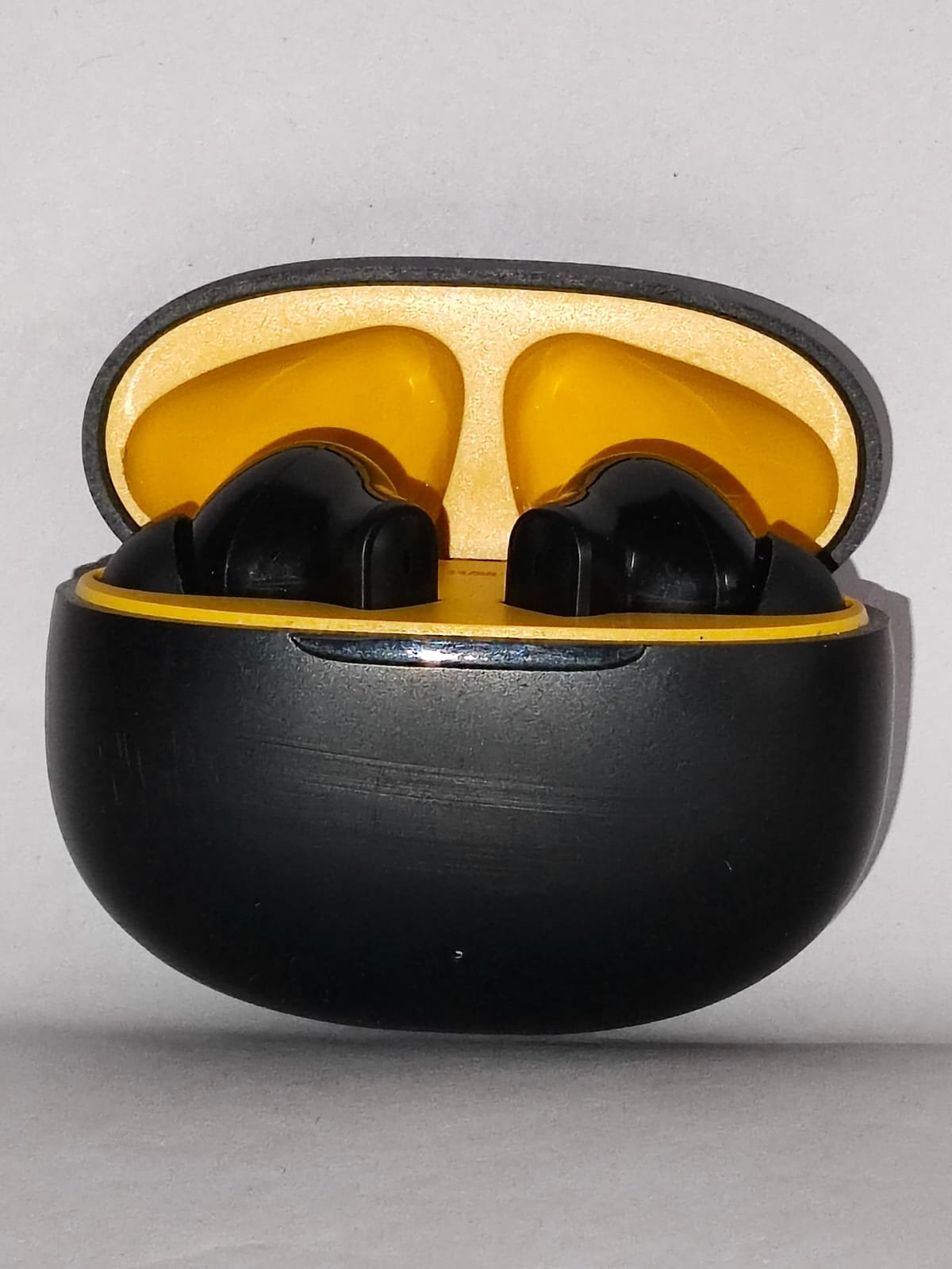 Air Champs Wireless Bluetooth Earbuds – Sleek Black & Yellow Design with Compact Charging Case